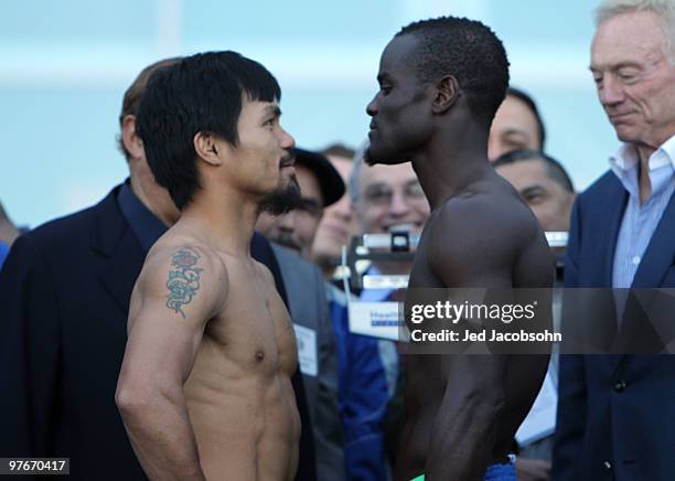 Manny Pacquiao of the Philippines and Joshua Clottey of Ghana pose after the weigh-in for their WBO welterweight title fight outside Cowboys Stadium...