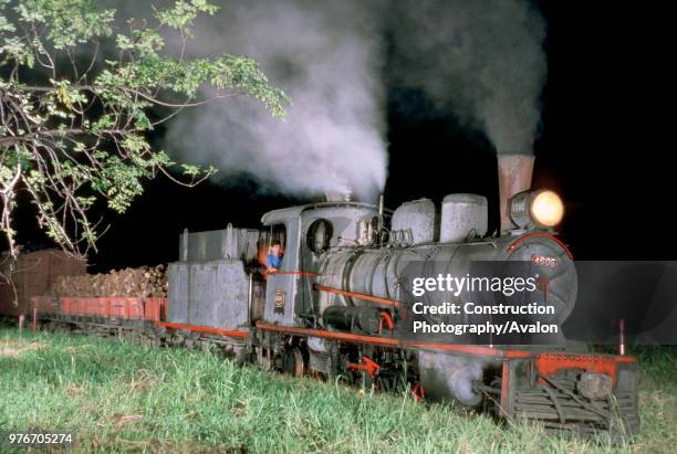 Night freight train leaves Santa Fe on Argentina's metre gauge Belgrano Railway behind an 8A class oil burning2-6-2 Prairie built by Societe Suisse...