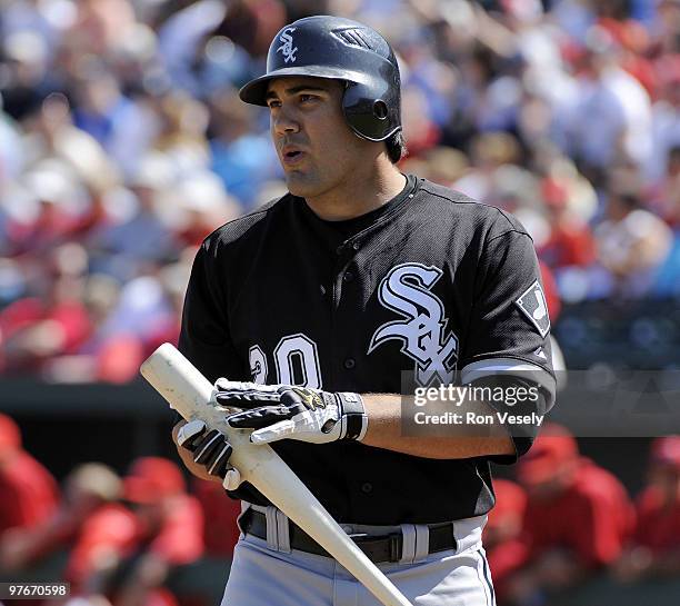 Carlos Quentin of the Chicago White Sox looks on during a spring training game against the Los Angeles Angels of Anaheim on March 12, 2010 at Tempe...