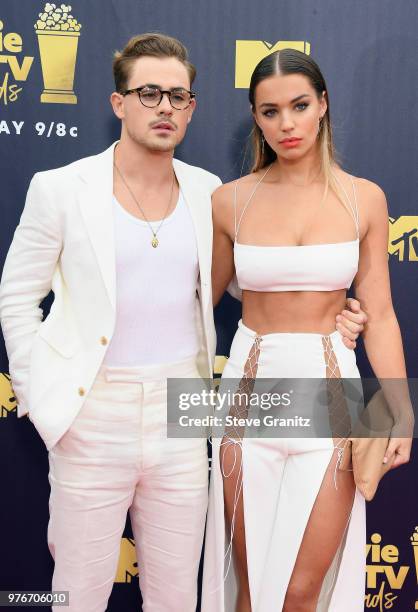 Actor Dacre Montgomery and model Liv Pollock attend the 2018 MTV Movie And TV Awards at Barker Hangar on June 16, 2018 in Santa Monica, California.