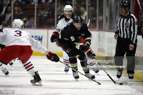 Marc Methot of the Columbus Blue Jackets defends the play of Bobby Ryan of the Anaheim Ducks as Ryan backhands the puck into the Blue Jackets zone...