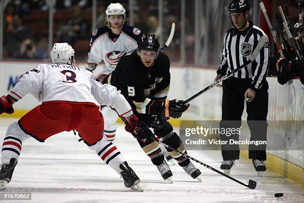 Marc Methot of the Columbus Blue Jackets defends the play of Bobby Ryan of the Anaheim Ducks after Ryan backhanded the puck into the Blue Jackets...