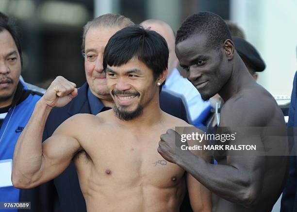 Welterweight boxers Manny Pacquiao of the Philippines and Joshua Clottey of Ghana pose for the press during their weigh-in at the Dallas Cowboys...