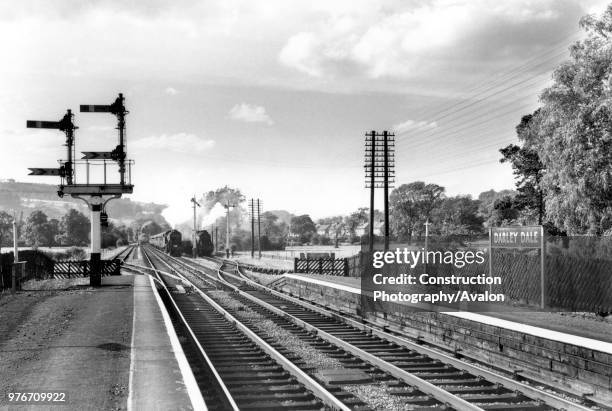 Scene looking north-west from the MRs Darley Dale station, approximately 20 miles from Derby. LMS upper quadrant signals are seen on the left while...