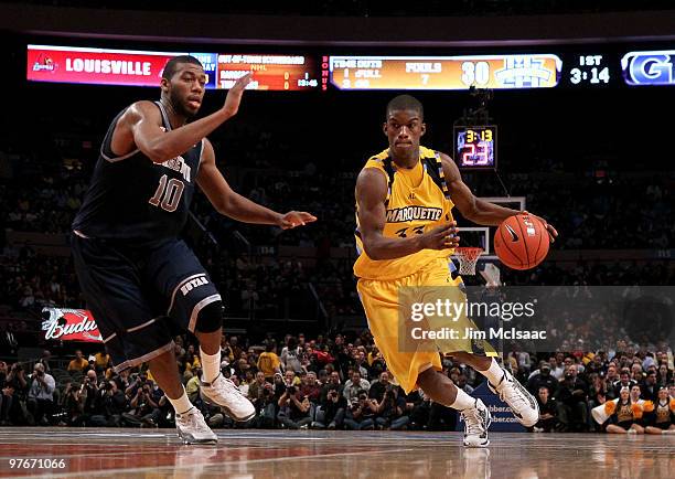Jimmy Butler of the Marquette Golden Eagles handles the ball against Greg Monroe of the Georgetown Hoyas during the semifinal of the 2010 Big East...