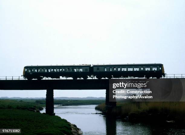 Drigg, Cumbria. Silhouette of 13.47 ex Whitehaven for Barrow crossing the river Irt, 25.4.87.