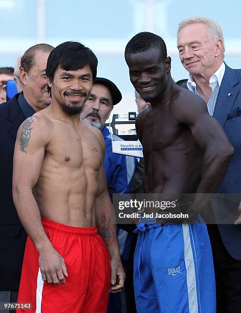 Manny Pacquiao of the Philippines and Joshua Clottey of Ghana pose after the weigh-in for their WBO welterweight title fight outside Cowboys Stadium...