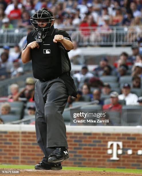 Home plate umpire Doug Eddings calls a third strike during the game between the Atlanta Braves and the San Diego Padres at SunTrust Park on June 16,...