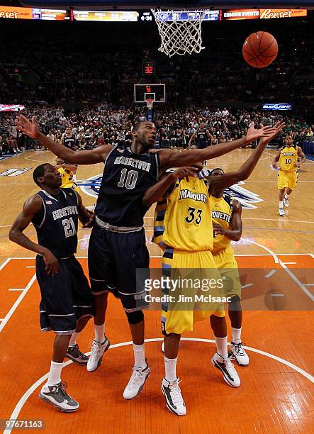 Greg Monroe of the Georgetown Hoyas goes for a loose ball with Jimmy Butler of the Marquette Golden Eagles during the semifinal of the 2010 Big East...