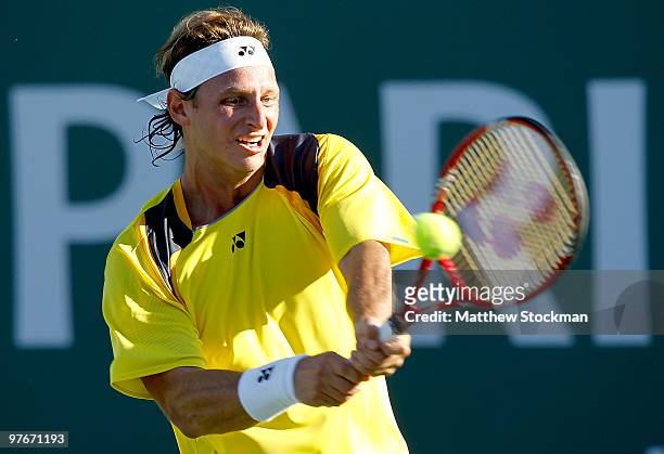 David Nalbandian of Argentina returns a shot to Stefan Koubek of Austria during the BNP Paribas Open on March 12, 2010 in Indian Wells, California.