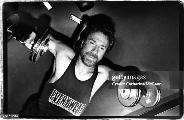 American martial artist and actor Chuck Norris exercises by lifting weights on April 1993 in New York City, New York.