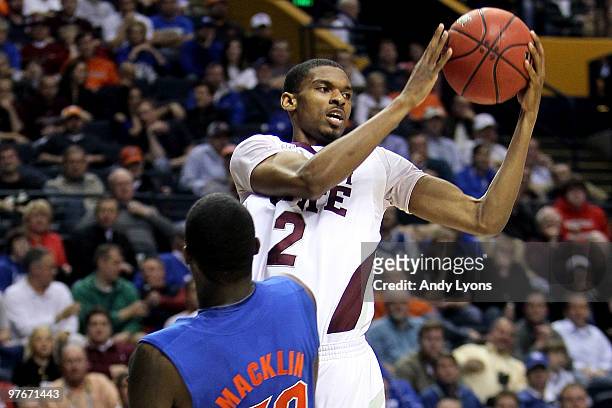 Ravern Johnson of Romero Osby looks to pass as he drives against Vernon Macklin of the Mississippi State Bulldogs against the Florida Gators during...