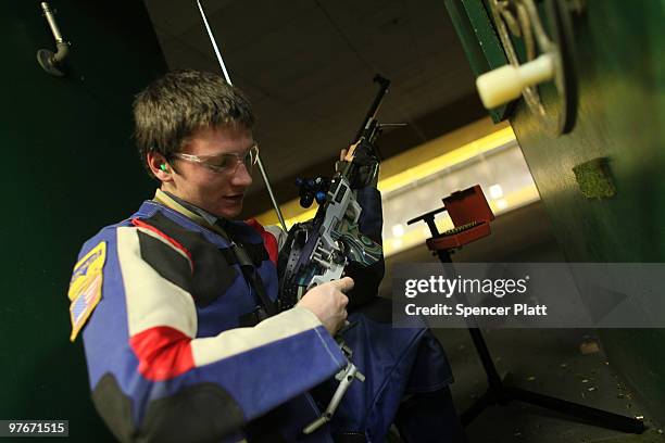 Nick Sautter checks his gun during competition at the 79th Anniversary Gallery Match for area high school students at the Blue Trail Range on March...