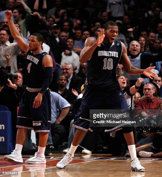 Greg Monroe and Chris Wright of the Georgetown Hoyas reacts after a play late in the game against the Marquette Golden Eagles during the semifinal of...