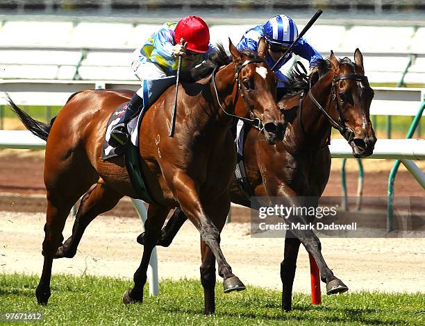 Jockey Craig Williams riding Response wins Race 3 the Volunteers Matron Stakes during the Super Family Day meeting at Flemington Racecourse on March...