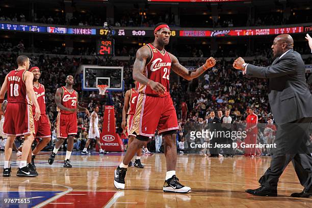 LeBron James walks up to Mike Brown Head Coach of the Cleveland Cavaliers during the game against the Philadelphia 76ers on March 12, 2010 at the...