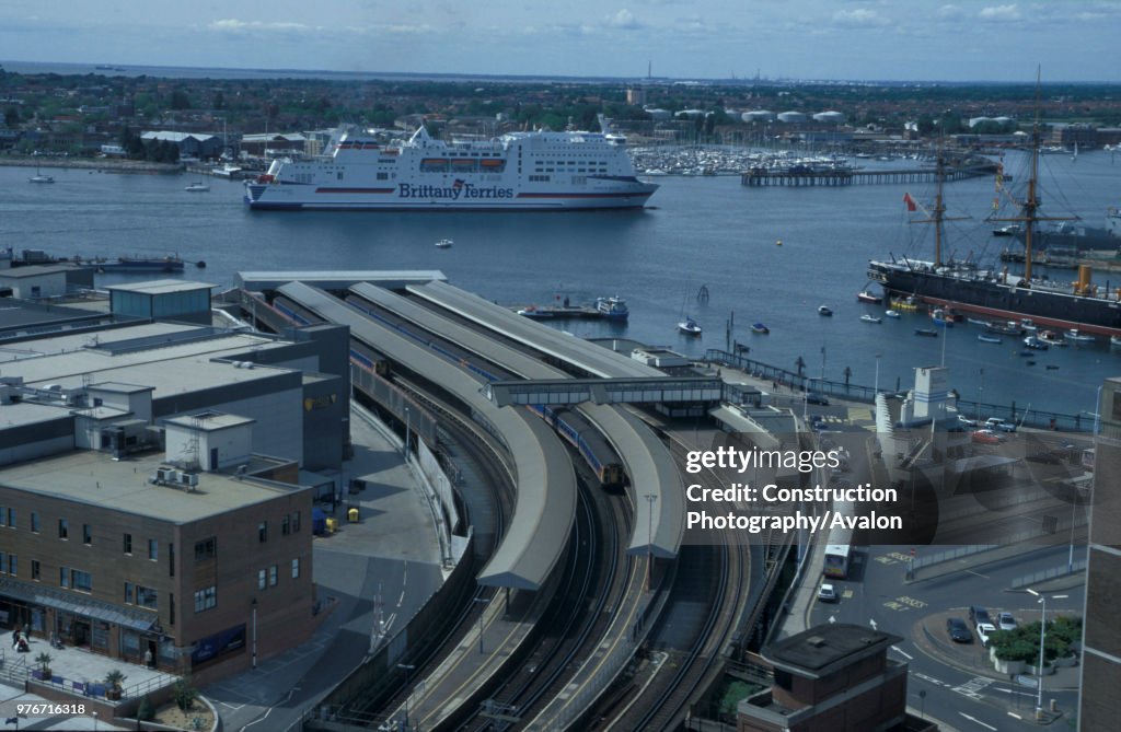 Aerial view over Portsmouth Harbour station with a fine view of the Portsmouth to St Malo ferry in the Solent and the historic HMS Warrior in Portsmouth harbour. C 2002