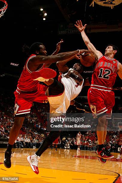 Dwyane Wade of the Miami Heat shoots against the Chicago Bulls on March 12, 2010 at American Airlines Arena in Miami, Florida. NOTE TO USER: User...