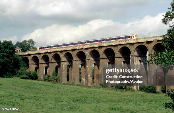 Balcombe Viaduct on the London to Brighton line with a Class 319 EMU crossing, circa 1993, United Kingdom.