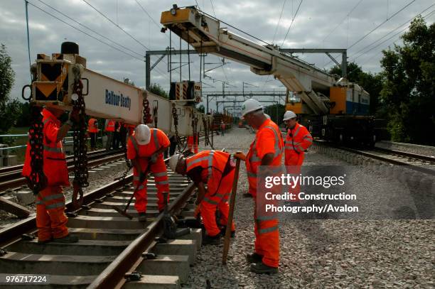 Balfour Beatty's widely admired Kirov Crane lowers track panels into place at Bourne End in August 2003 during the West Coast Main Line upgrade. ,...