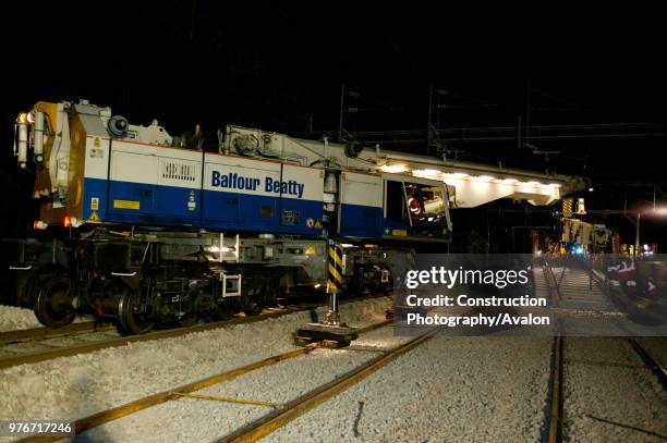 Balfour Beatty's widely admired Kirov Crane lowers track panels into place at Bourne End in August 2003 during the West Coast Main Line upgrade. ,...