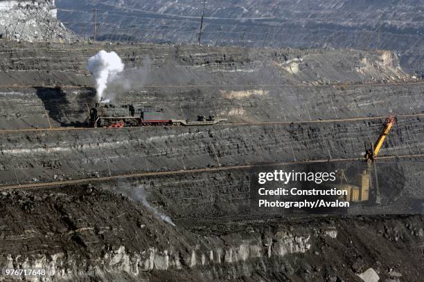 Chinese class SY industrial 2-8-2 at work in the huge opencast mine at Pingzhuang in October 2006.