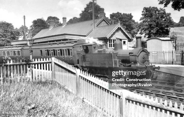 Chipping Norton station with a GW 2-4-0T No 457 on 4 August 1934. The train is a two coach shuttle service from Kingham on the Cotswold line. Kingham...