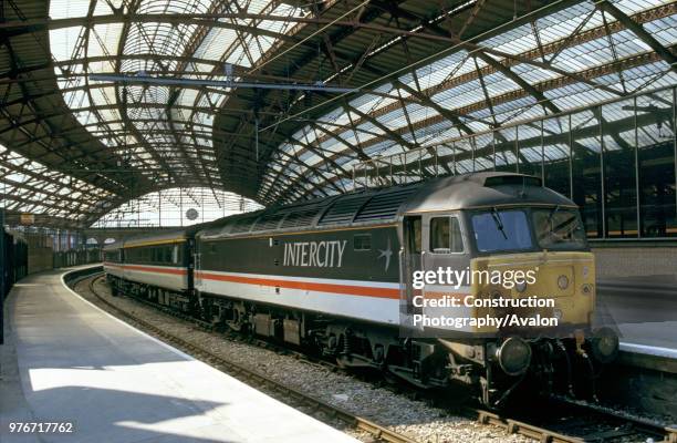 Class 47 diesel electric in InterCity livery stands with a train at Liverpool Lime Street station, circa 1993.