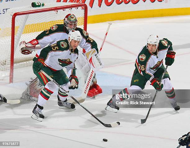 Cam Barker Jaime Sifers and Josh Harding of the Minnesota Wild defend against the Buffalo Sabres at HSBC Arena on March 12, 2010 in Buffalo, New York.