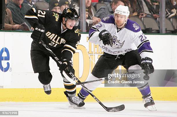 Loui Eriksson of the Dallas Stars handles the puck against Jeff Halpern of the Los Angeles Kings on March 12, 2010 at the American Airlines Center in...