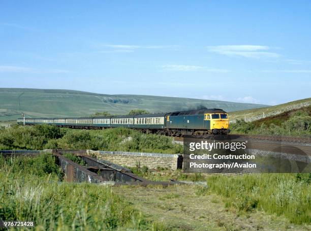 Garsdale. No 47336 with the 10:35 ex Carlisle for Leeds passes the old turn table at Garsdale on the Settle and Carlisle line. . , United Kingdom.