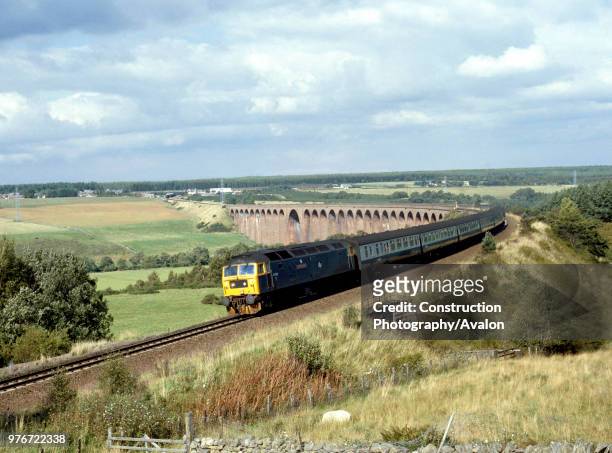 Highland Line. No 47.562 comes off Culloden Moor Viaduct with the 14.15 ex Inverness for Edinburgh. 2.9.88, United Kingdom.