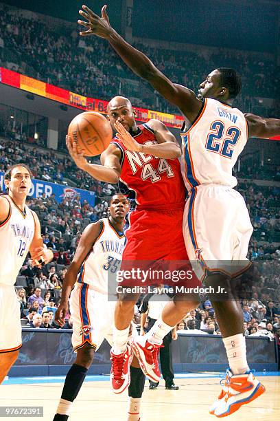 Trenton Hassell of the New Jersey Nets goes to the basket against Jeff Green of the Oklahoma City Thunder on March 12, 2010 at the Ford Center in...