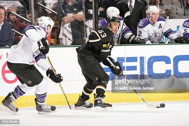 Mike Ribeiro of the Dallas Stars skates against Rob Scuderi of the Los Angeles Kings on March 12, 2010 at the American Airlines Center in Dallas,...