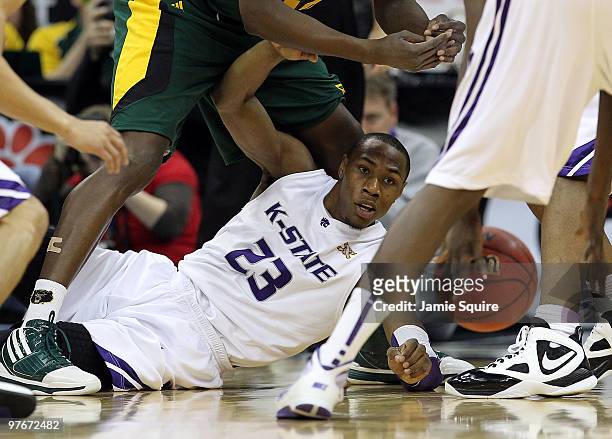 Dominique Sutton of the Kansas State Wildcats dives for a loose ball during the semifinals of the 2010 Phillips 66 Big 12 Men's Basketball Tournament...