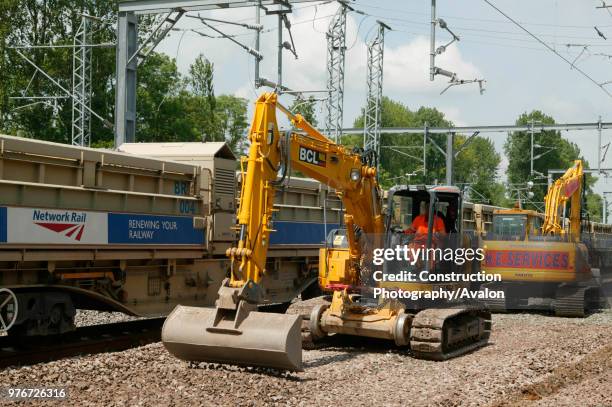 Network Rail discharging hopper realist the alignment to the south of Tring station during the West Coast Main Line upgrade. Wednesday 2nd June 2004,...