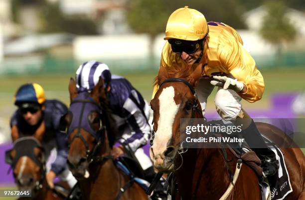 Opie Bosson riding Vosne Romanee celebrates winning the SkyCity New Zealand Stakes during the SkyCity Diamond Day meeting at Ellerslie on March 13,...