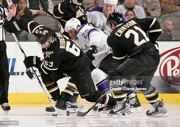 Mike Ribeiro and Loui Eriksson of the Dallas Stars try to keep the puck away against Jarret Stoll of the Los Angeles Kings on March 12, 2010 at the...