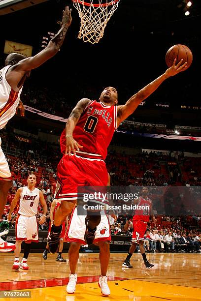 Acie Law of the Chicago Bulls shoots against the Joel Anthony of the Miami Heat on March 12, 2010 at American Airlines Arena in Miami, Florida. NOTE...