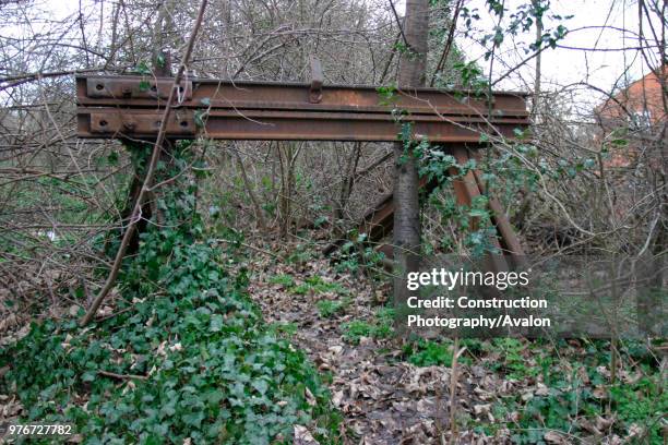 Overgrown buffer stops mark the end of the line for the disused Luton to Dunstable branch line at Dunstable. January 2004, United Kingdom.