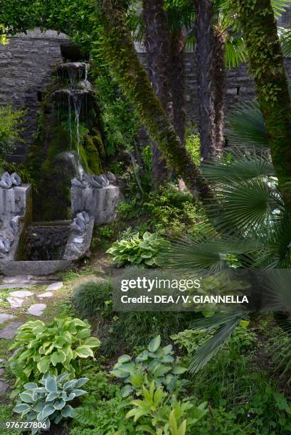 Nook of the garden of Villa Monastero, with a waterfall fountain, Varenna, Lombardy, Italy, 19th-20th century.