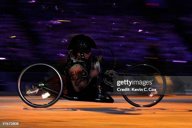 One of three-wheeled motorbike riders performs a driving rock song during the Opening Ceremony of the 2010 Vancouver Winter Paralympic Games at BC...