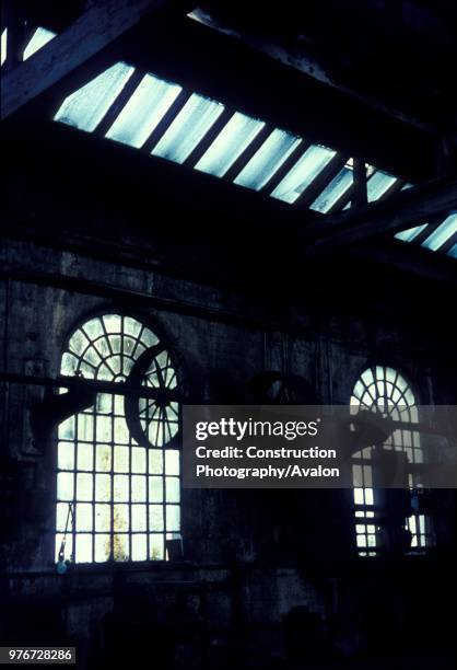 Pulley wheels for driving machine tools in the abandoned steam locomotive depot at Patricroft in Manchester. Sunday 1st September 1968.