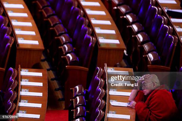 Tibetan monk attends the closing meeting of the Chinese People's Political Consultative Conference at the Great Hall of the People on March 13, 2010...