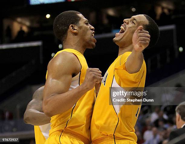 Jamal Boykin and Omondi Amoke of the California Golden Bears celebrate after the game against the UCLA Bruins during the semifinals of the Pac-10...