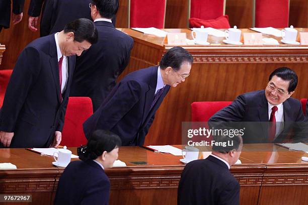 China's President Hu Jintao, Premier Wen Jiabao and Vice President Xi Jinping attends the closing meeting of the Chinese People's Political...