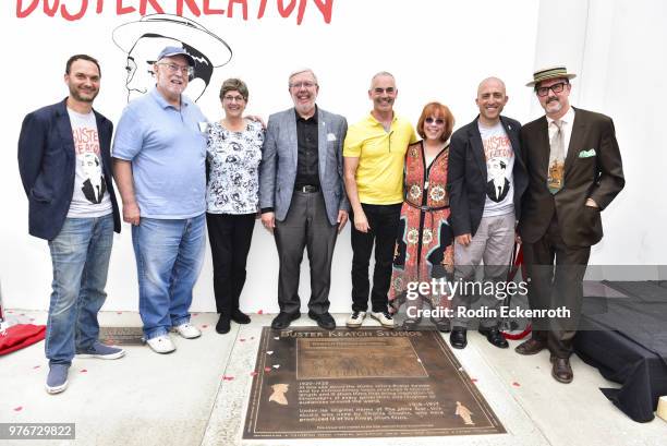 Jeff Vespa, Harry Keaton, Melissa Talmadge Cox, Leonard Maltin, Mitch O'Farrell, Patricia Eliot Tobias, Alek Lev, and David Arquette pose with plaque...