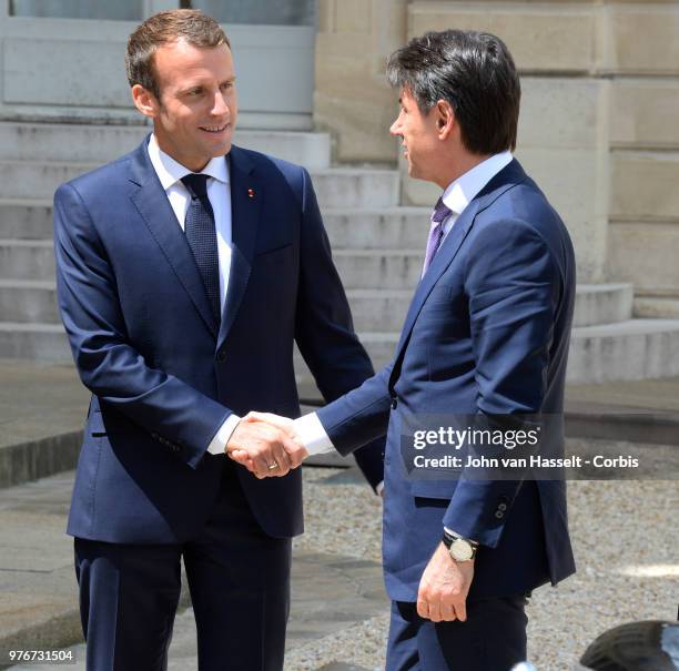 French President Emmanuel Macron receives the new Italian Prime Minister Giuseppe Conte at the Elysee Palace on June 15, 2018 in Paris, France. The...