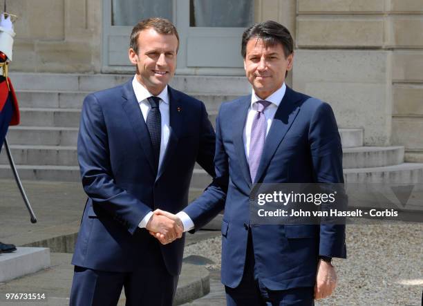 French President Emmanuel Macron receives the new Italian Prime Minister Giuseppe Conte at the Elysee Palace on June 15, 2018 in Paris, France. The...