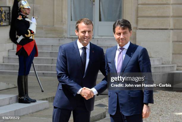 French President Emmanuel Macron receives the new Italian Prime Minister Giuseppe Conte at the Elysee Palace on June 15, 2018 in Paris, France. The...